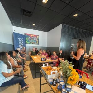 Woman teaching class in coffee shop